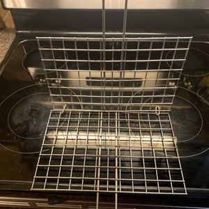 Fish cooking grill implement